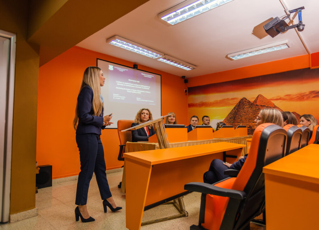 Student giving a presentation in front of a classroom