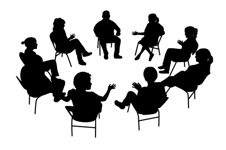 People sitting in a circle discussing with each