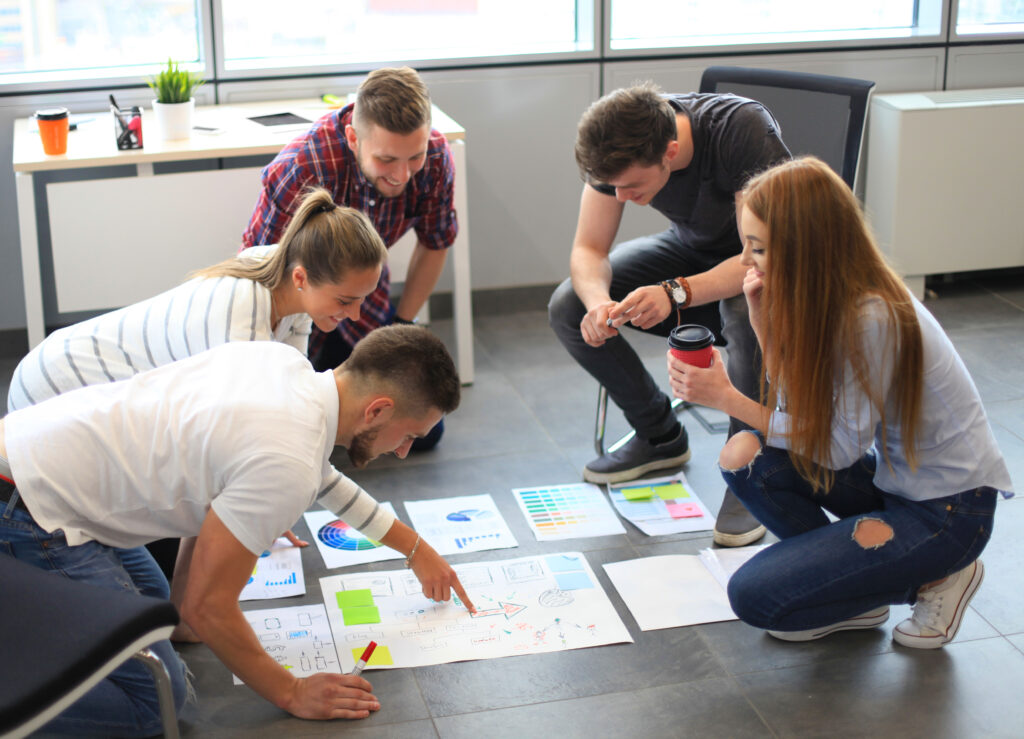 Group of young people working on a project together