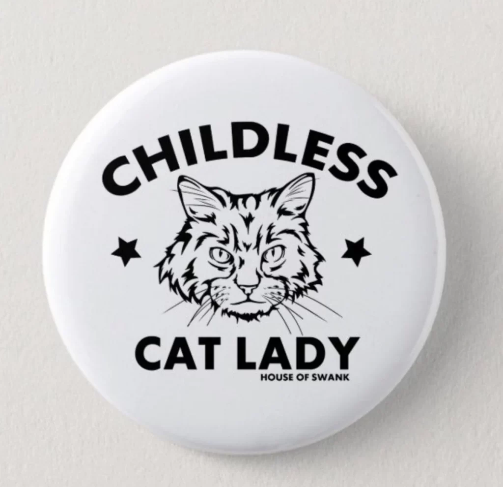 a picture of a magnet that says "childless cat lady" with the face of a cat in the middle