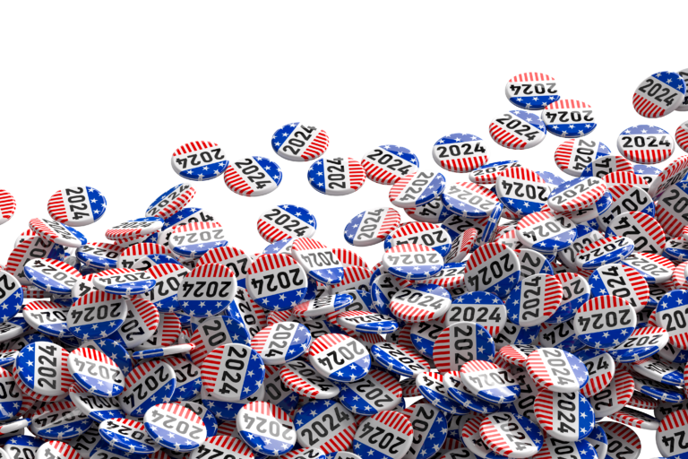 a picture of a pile of generic campaign buttons that say "2024"